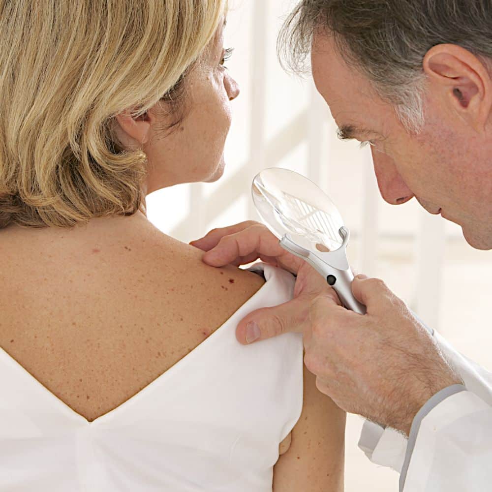 doctor and patient - - looking for skin disease